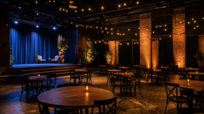 Event hall with string lights, round tables and a small stage, How to Become a Wedding Officiant in Pennsylvania (and Why Couples Can Self-Unite)